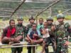 Sehat Bersama Masyarakat, Satgas Yonif/Mtl Ajak Olahraga Bersama Masyarakat