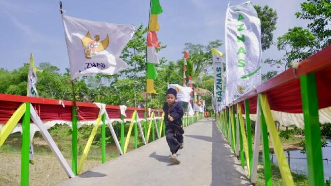 Jembatan Rp300 Juta dari Kembalian Belanja Konsumen Alfamart